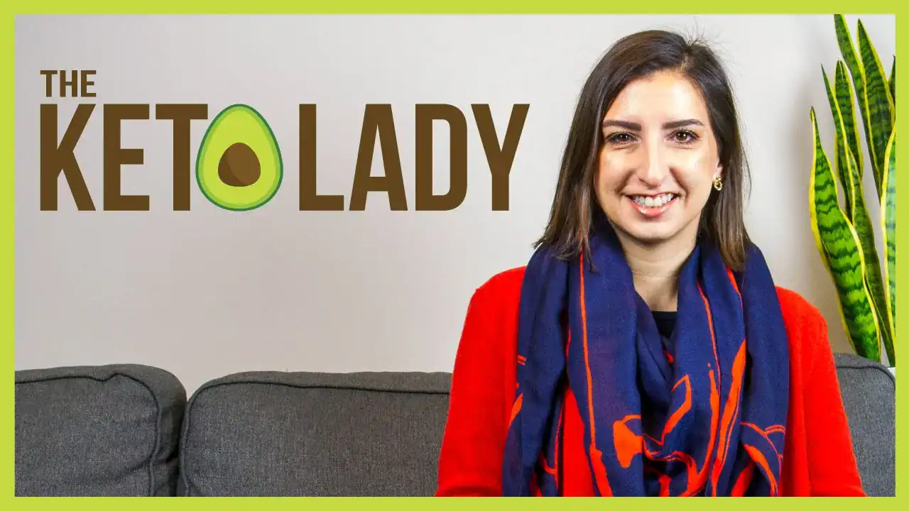 Avocado-themed logo and friendly woman smiling on a grey sofa, promoting keto-friendly recipes and tips by The Keto Lady in Canada.