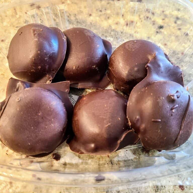 Rich, homemade keto chocolate truffles perfect for low-carb, high-fat ketogenic diets, made with simple ingredients and coated in smooth, glossy dark chocolate. Ideal for keto snacking and dessert.
