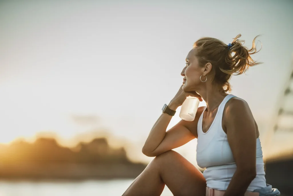 Healthy woman over 40 exercising at home during a fitness coaching program