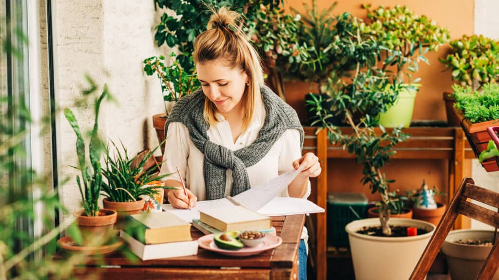 Woman planning a simple health reset program at home