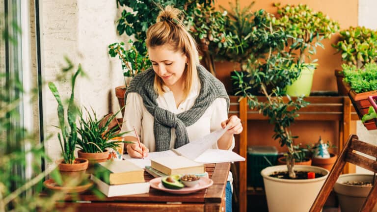 Woman planning a simple health reset program at home