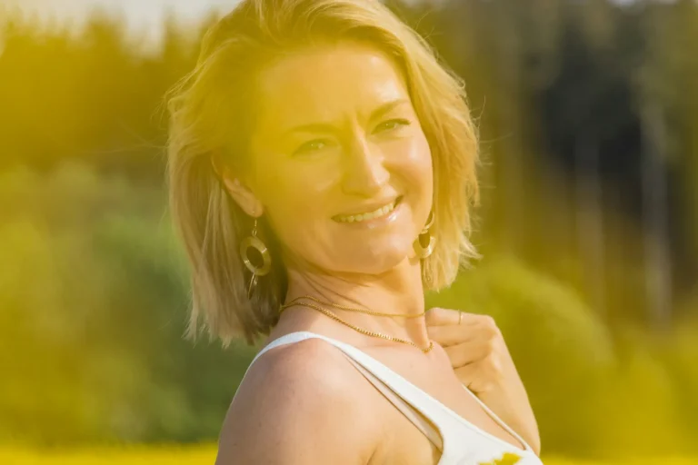 Woman over 40 enjoying a healthy lifestyle in a bright kitchen